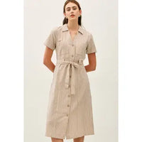 Woman wearing Ensley taupe striped utility button-up midi shirt dress with tie waist