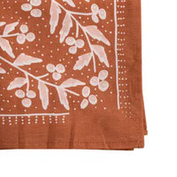 Terra copper and pink floral cotton bandana folded to show print detail
