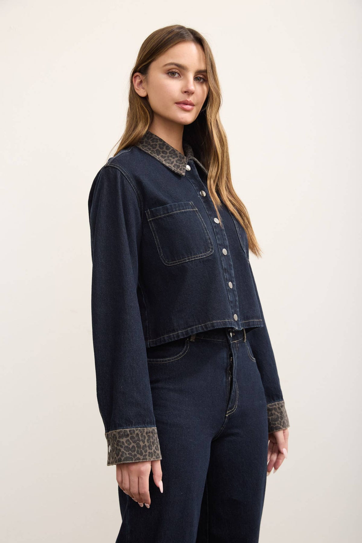 Front view of Autumn denim shacket with snap closure