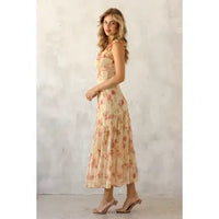 Yellow floral tiered ruffle midi dress on model