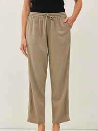 Mocha linen blend high-waisted pants with crochet side trim from Glitz Fine Clothing