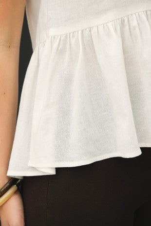 Ivory linen peplum top with gathered waist and front buttons