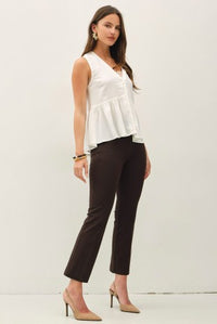 Ivory sleeveless V-neck linen blend peplum top on model