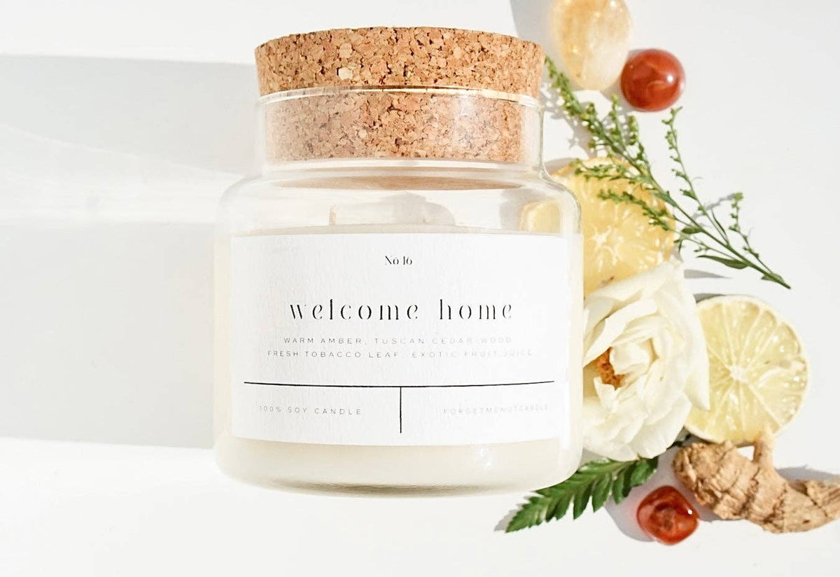 Forget Me Not Welcome Home 22 oz soy candle in glass apothecary jar with cork lid