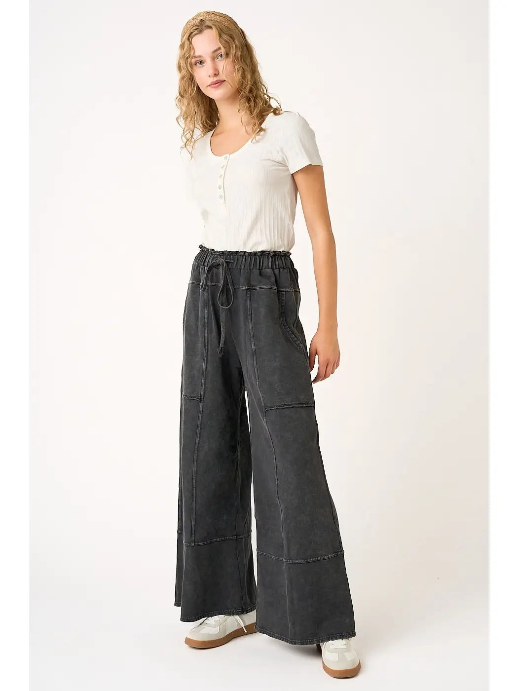 Woman wearing Simone black mineral wash high-rise wide-leg pants with side pockets