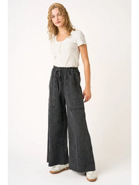 Woman wearing Simone black mineral wash high-rise wide-leg pants with side pockets