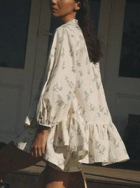 Rosa Ditsy Floral Peplum Blouse and Shorts Two-Piece Set in cream, side view showing peplum silhouette