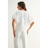 Ramona white cotton eyelet blouse styled, side view