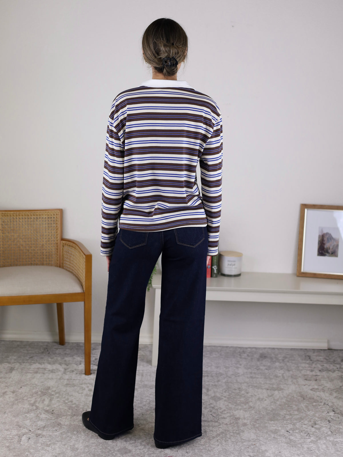 A person viewed from behind wears a Striped Rugby Top with Contrast Collar over dark blue wide-leg jeans.