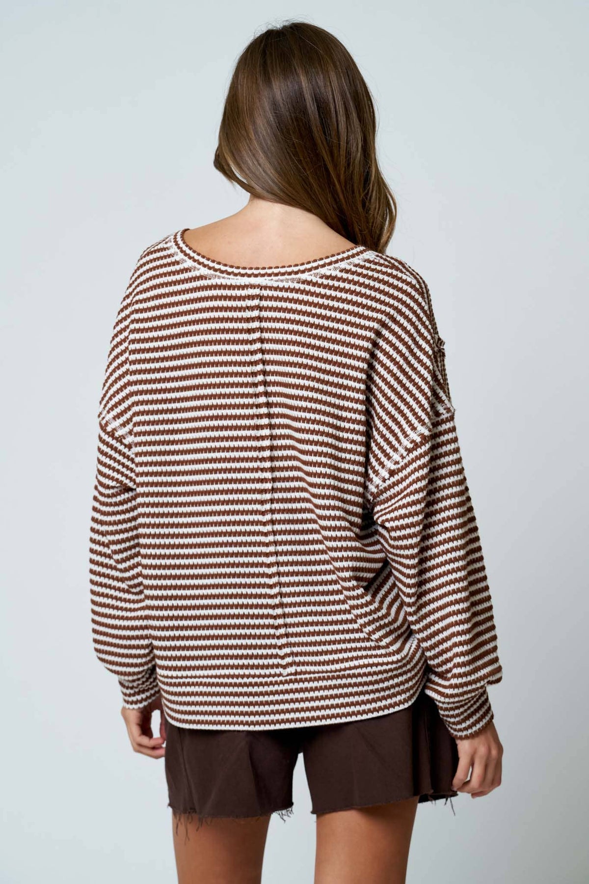 Close-up of exposed seam detail on Lennon stripe top