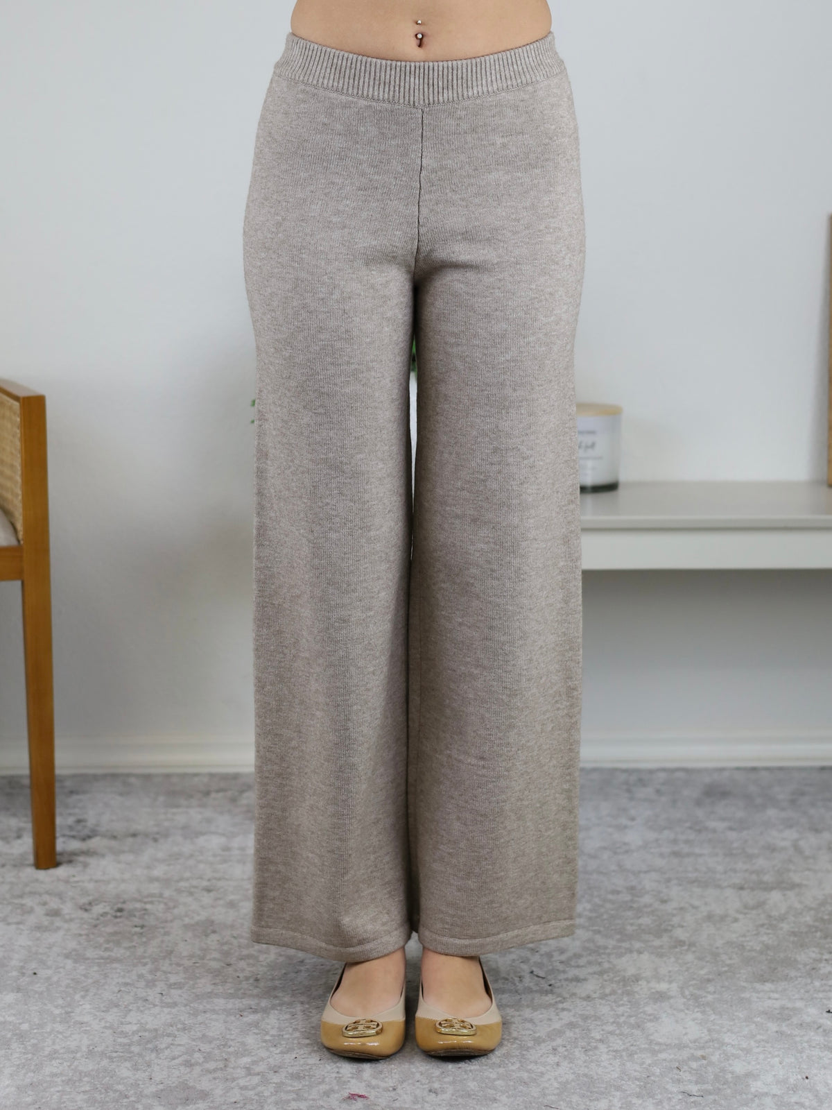 Beige knit wide-leg pants from the Rebecca Sweater/Pant Set featuring a high elastic waistband paired with tan ballet flats.