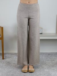 Beige knit wide-leg pants from the Rebecca Sweater/Pant Set featuring a high elastic waistband paired with tan ballet flats.