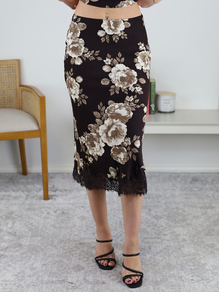 Allison Lace Trim Midi Skirt in black with a white floral print and a black lace trim at the hem, perfect for a fall wardrobe.
