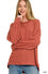 Lane Exposed Seam Top in rust ribbed knit with hi-low hem and side slits