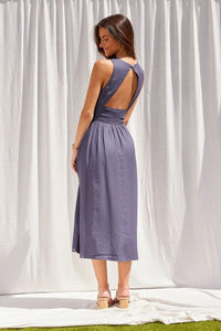 Blue smocked waist midi dress with boat neckline from Glitz Fine Clothing