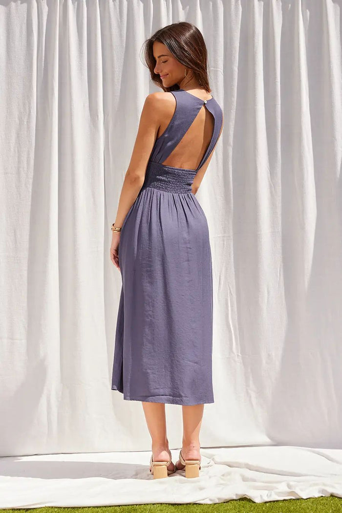 Blue smocked waist midi dress with boat neckline from Glitz Fine Clothing