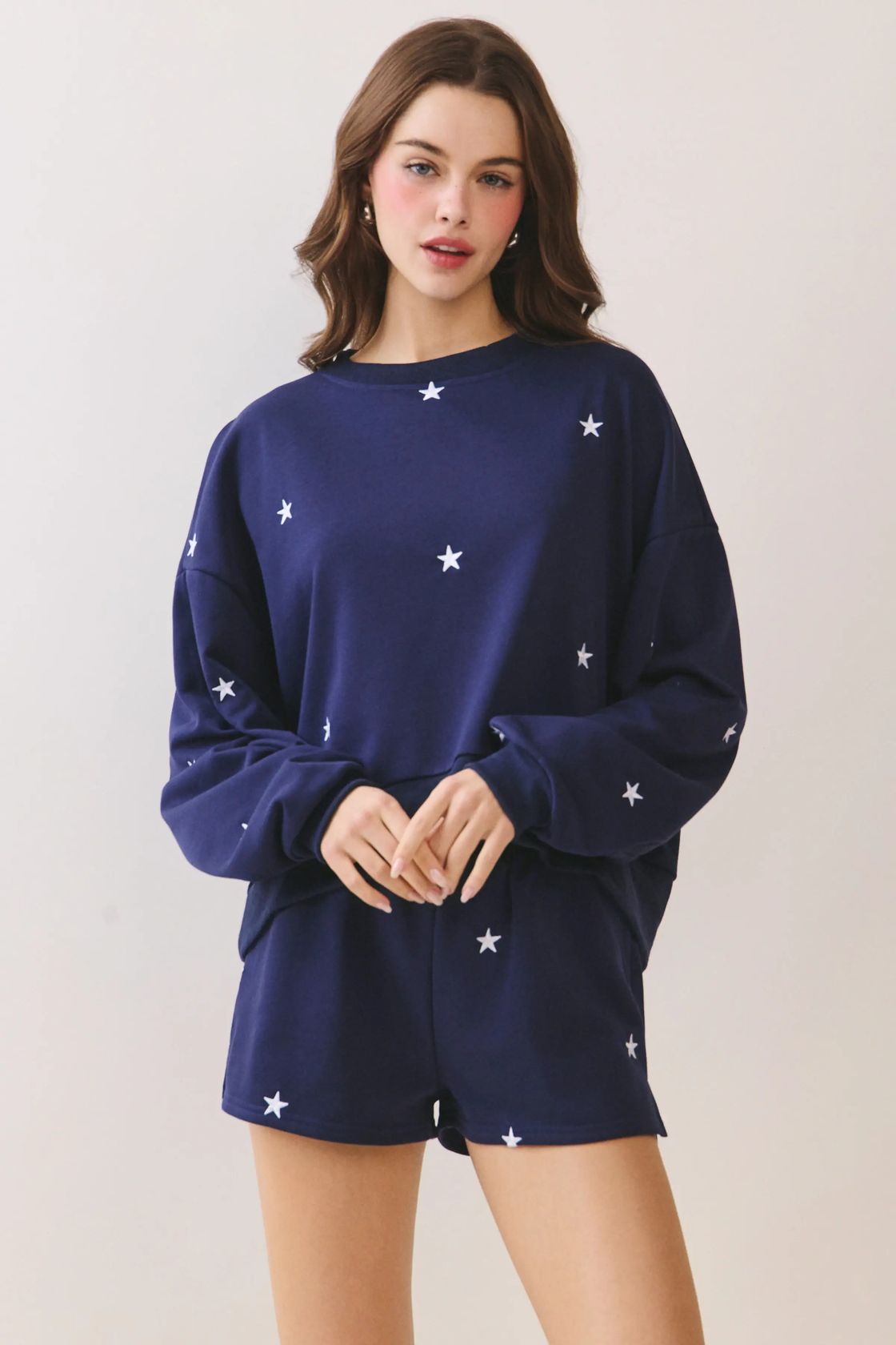 Woman wearing Lulu navy allover star embroidery drop-shoulder sweatshirt