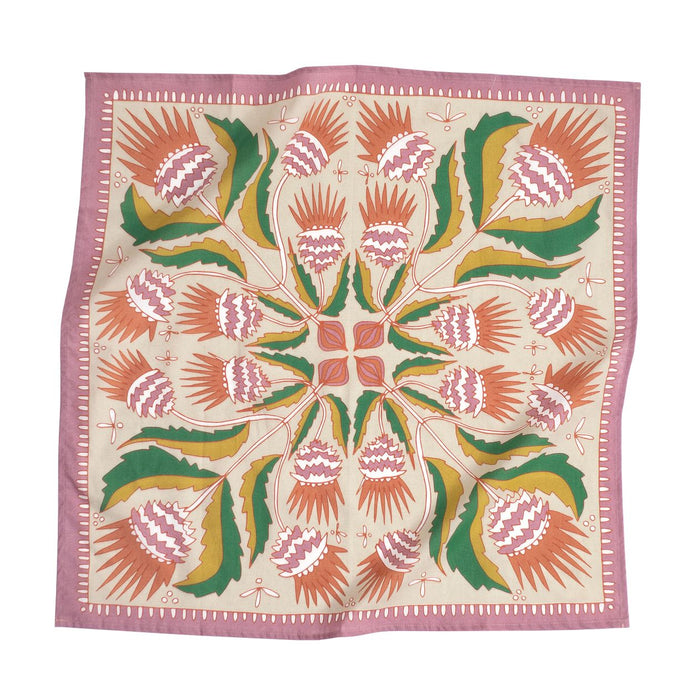 No. 081 Martha Bandana in tan cotton with orange and green floral print, flat lay