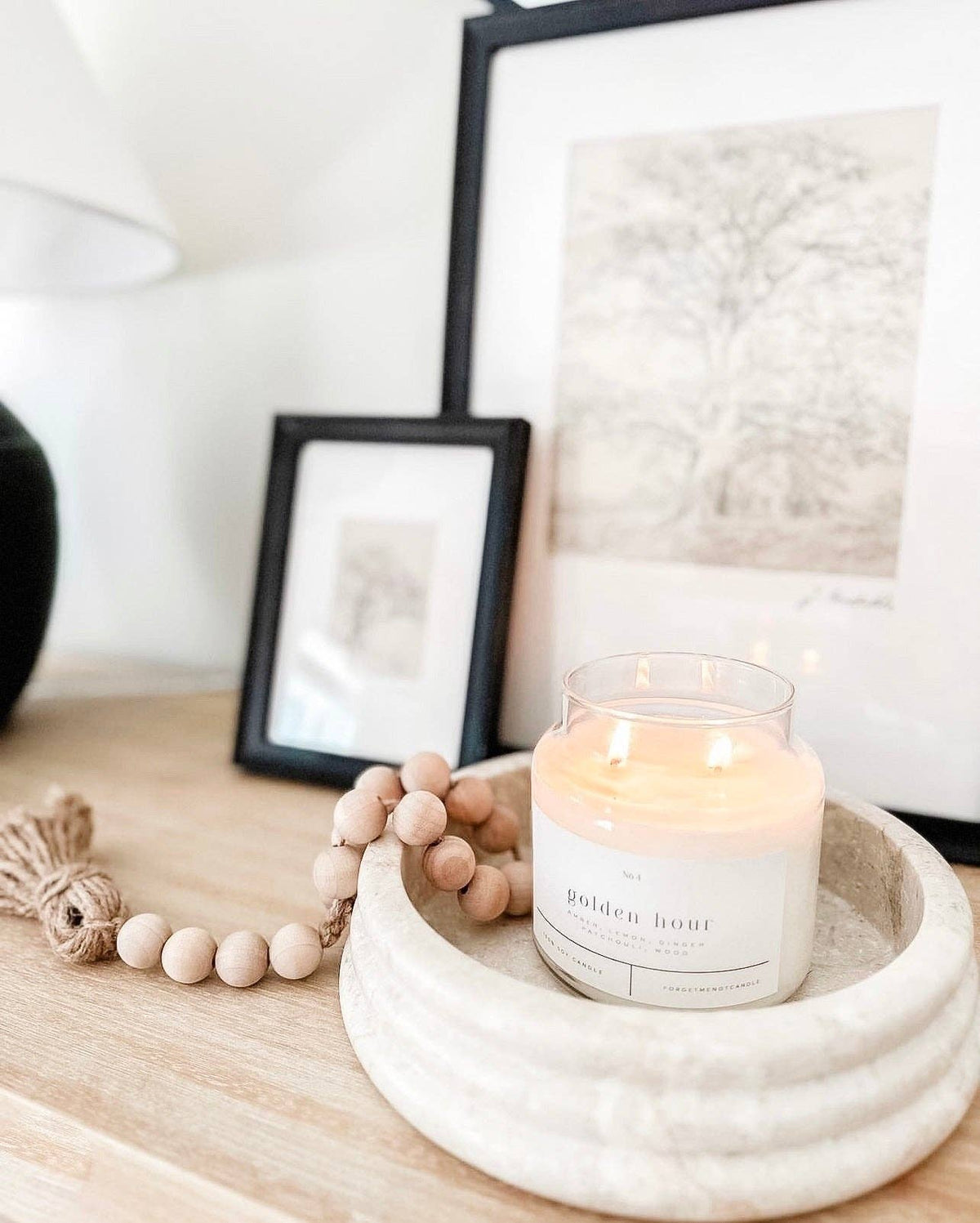 Golden Hour soy candle by Forget Me Not Candle Co. styled in a warm home setting