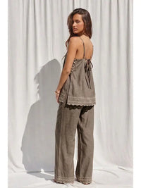 Embroidery detail on mocha two-piece pant set, close view