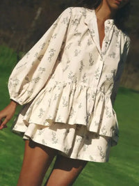 Woman styling the Rosa Ditsy Floral Peplum Blouse and Shorts Two-Piece Set in cream