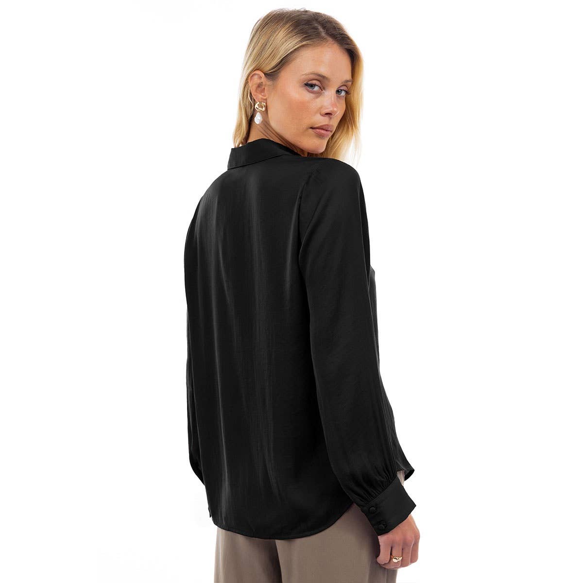 A woman wearing a wine-colored Naked Zebra - Neck Shirt With Open Seam Sleeve made of long-sleeved woven polyester with open seam sleeve details.