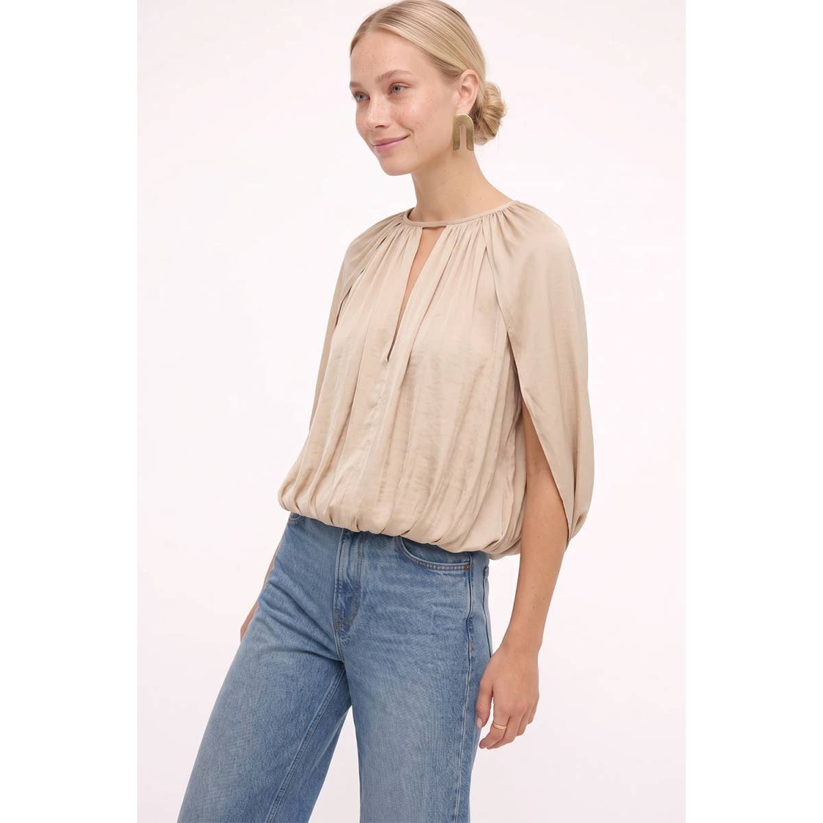 Naked Zebra - Silky Draped Cape Sleeve Blouse in wine, featuring a gathered neckline, keyhole cutout, and draped cape sleeves, worn with blue jeans.