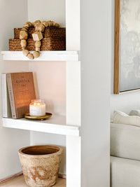 Afterglow soy candle by Forget Me Not Candle Co. styled in a home setting