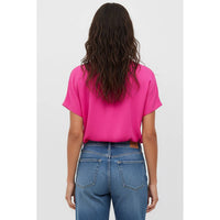 Back view of a person wearing a bright pink woven polyester Naked Zebra - Drop Shoulder Regular Blouse: Chocolate / L tucked into blue jeans.