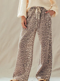 Rusty leopard print wide-leg pants, back view showing relaxed fit and print detail