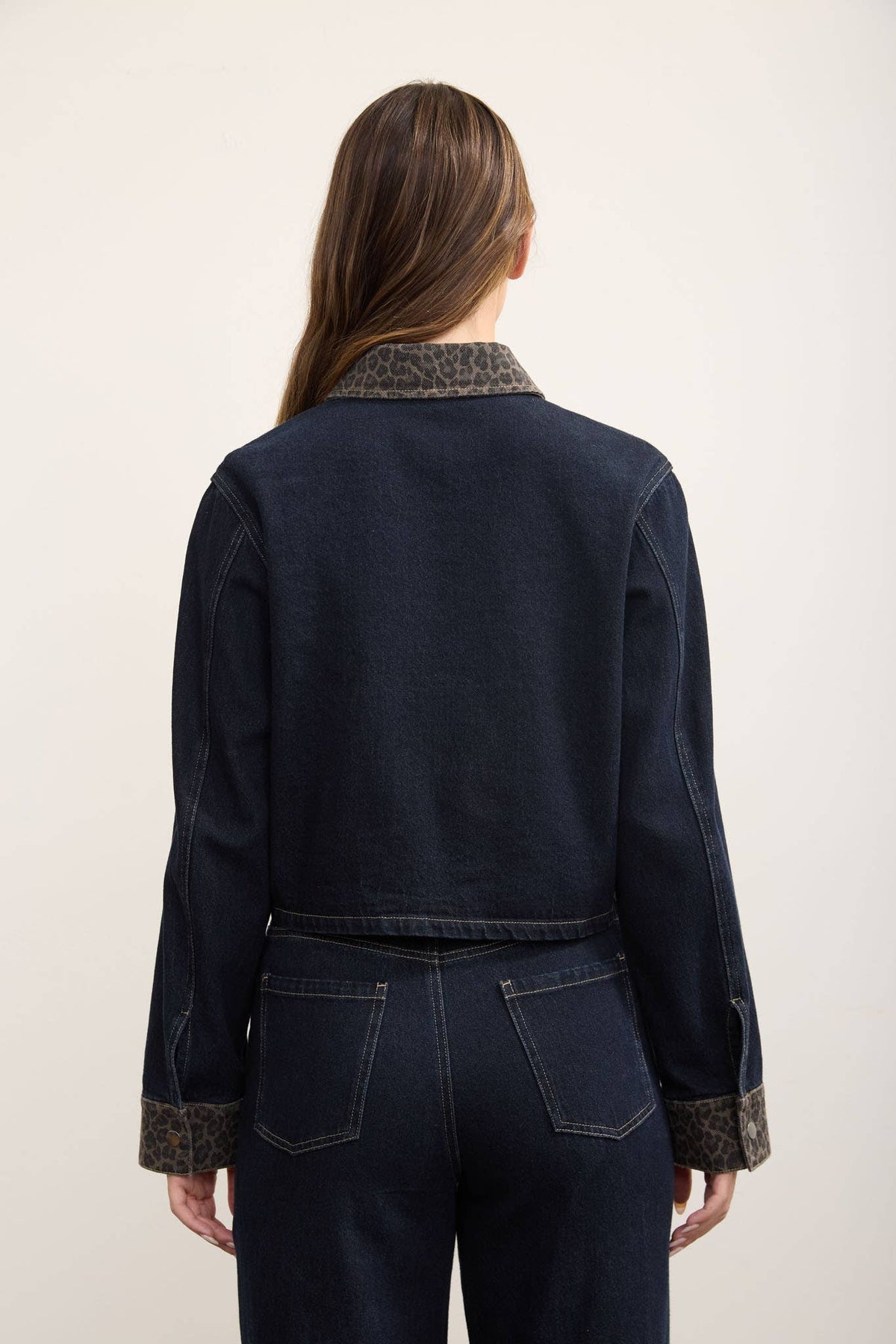 Close-up of leopard print collar trim on denim shacket