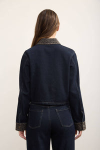 Close-up of leopard print collar trim on denim shacket