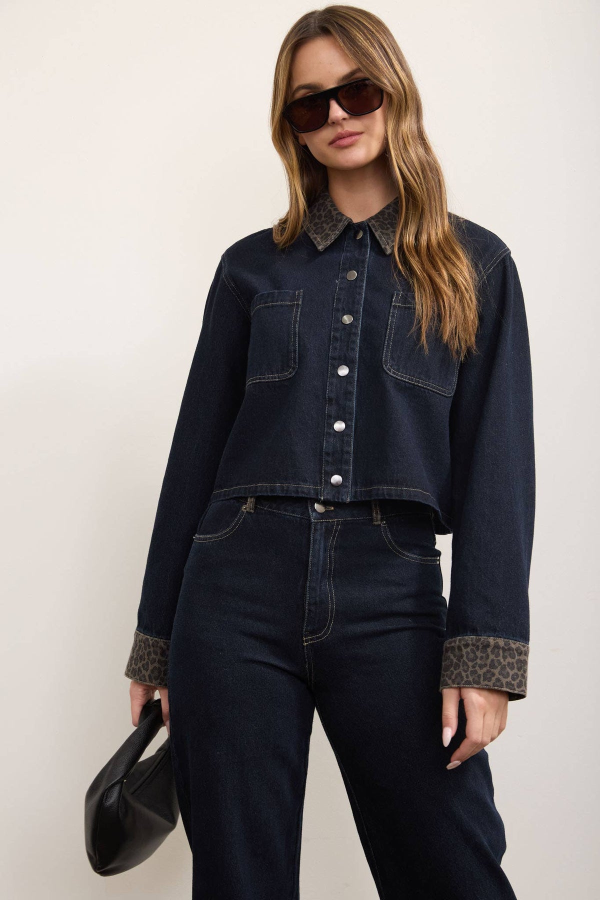 Close-up of chest pocket detail on denim shacket