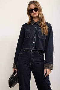 Close-up of chest pocket detail on denim shacket
