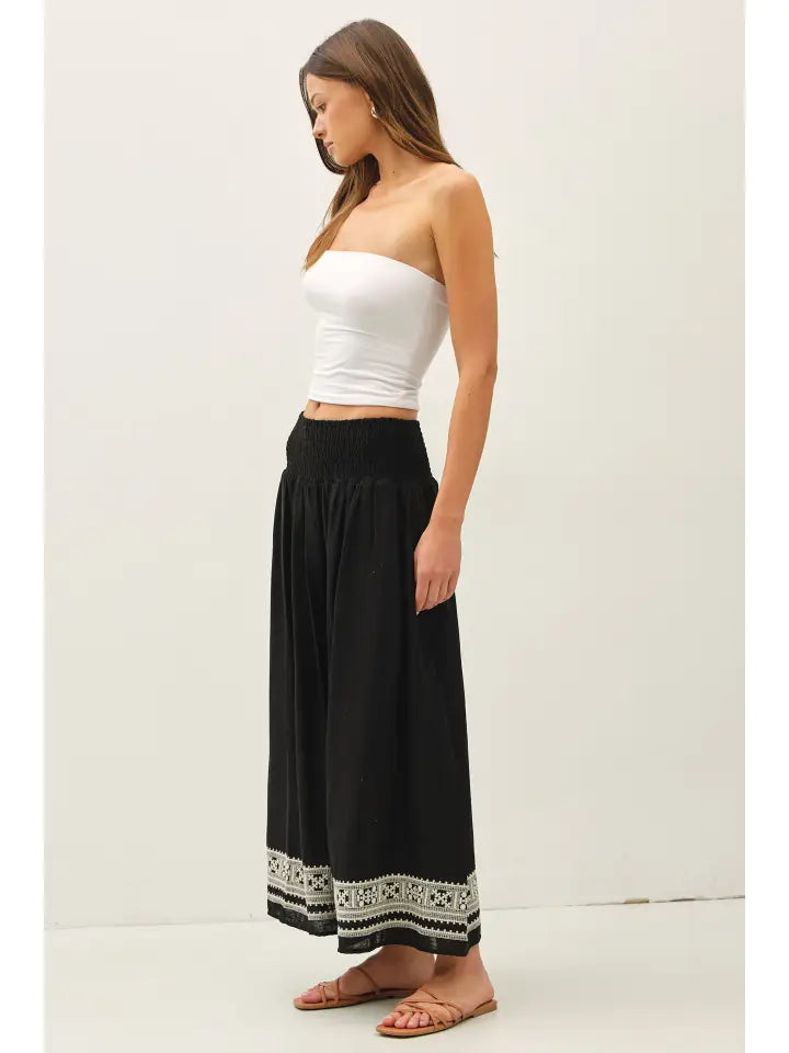 Embroidered hem detail on black linen blend maxi skirt – women's boutique skirt
