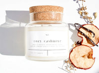 Forget Me Not Cozy Cashmere 22 oz soy candle in glass apothecary jar with cork lid
